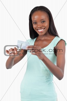 Smiling woman solving her financial problems
