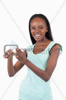 Angry woman destroying her credit card