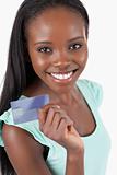Smiling young woman with her new credit card