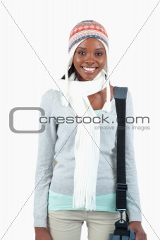 Smiling female student in winter clothing