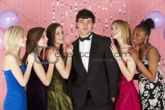Teenage Girls Looking At Attractive Boy