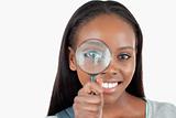 Young woman with magnifier