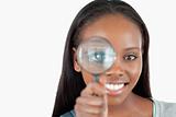Smiling woman with magnifier