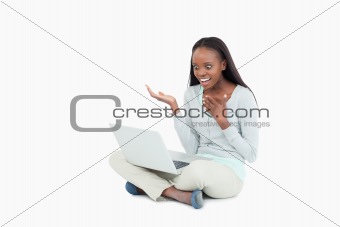 Young woman surprised by whats on her notebook