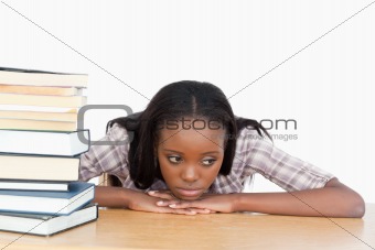 Tired student leaning on her hands