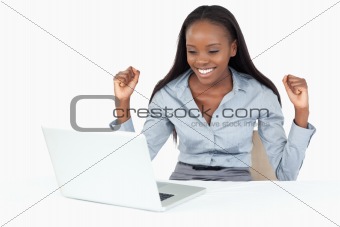 Cheerful businesswoman working with a notebook