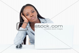 Bored businesswoman using a laptop