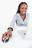 Portrait of a cute businesswoman using a laptop