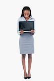 Portrait of a businesswoman showing a laptop