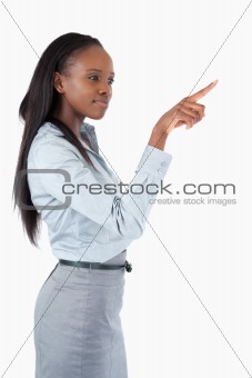 Portrait of a businesswoman pressing an invisible key