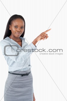 Portrait of a cute businesswoman pressing an invisible key