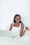 Portrait of a smiling woman purchasing online
