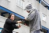 Man Mugging Woman In Street