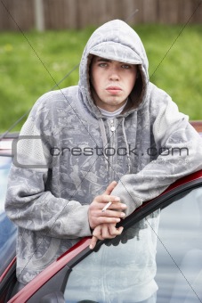 Young Man Standing Next To Car