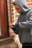 Young Man Breaking Into House