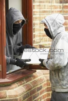 Young Men Breaking Into House