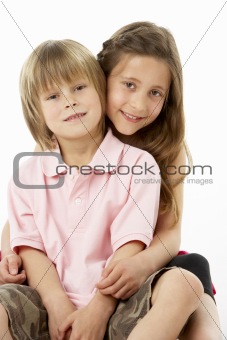 Two Children Sitting with each other in Studio