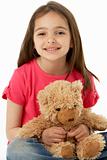 Studio Portrait Of Smiling Girl with Teddy Bear