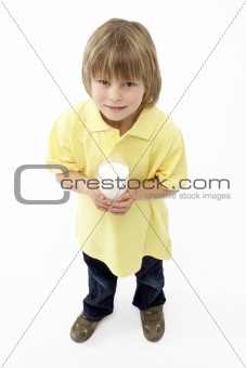 Studio Portrait of Smiling Boy Holding Glass of Milk