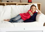 Young Girl Watching Television at Home