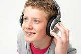 Portrait of Smiling Teenage Boy Listening to Music