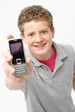 Portrait of Smiling Teenage Boy Holding Mobile Phone