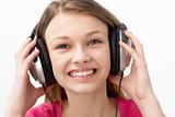 Portrait of Smiling Teenage Girl Listening to Music