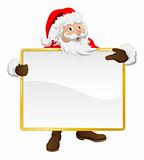 Santa holding Christmas sign and pointing