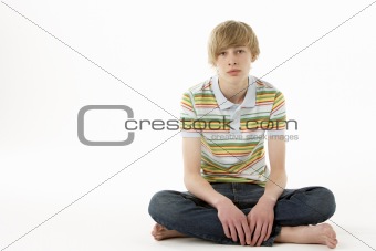 Studio Portrait Of Serious Teenage Boy