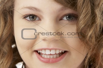 Studio Portrait Of Smiling Teenage Girl