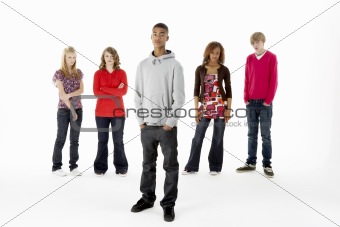 Full Length Studio Portrait Of Five Teenage Friends