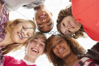 Five Teenage Friends Looking Down Into Camera