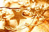 christmas golden stars symbols from branch