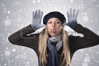 winter girl in wool cap and gloves 