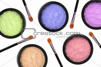 colorful cosmetics eyeshadows in box and brushes isolated on whi