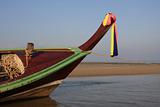 Longtail boat waiting for tide at Kamala beach