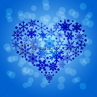 Christmas Snowflakes Heart Shape on Blurred Background