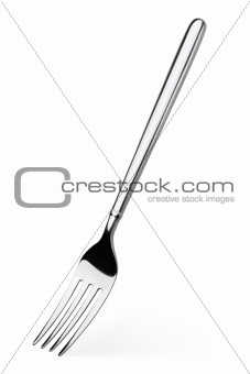 Silver fork stands vertically isolated on white