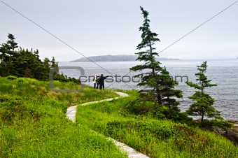 Father and children at Atlantic coast in Newfoundland