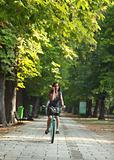 Woman on the phone riding bicycle