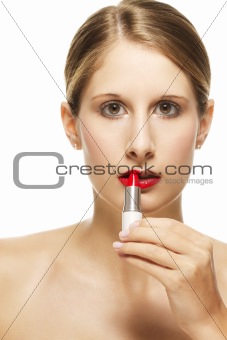 beautiful woman put on lipstick