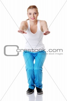 Teen girl doing exercises.