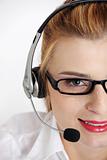 Closeup on woman`s face with headset.