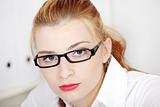 Businesswoman in glasses closeup.
