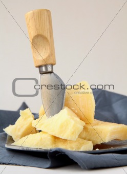 parmesan cheese  with knife