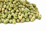 Close up view of scattered dried green pea on white background
