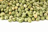 Scattered dried green pea on white background