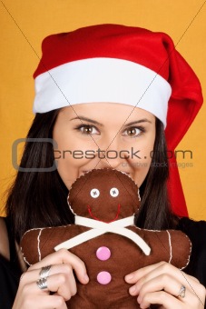Santa Claus girl with gingerbread man puppet