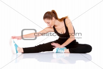 Beautiful fitness woman doing stretching exercise