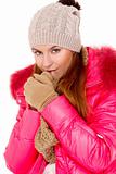 Young woman wearing winter jacket scarf and cap